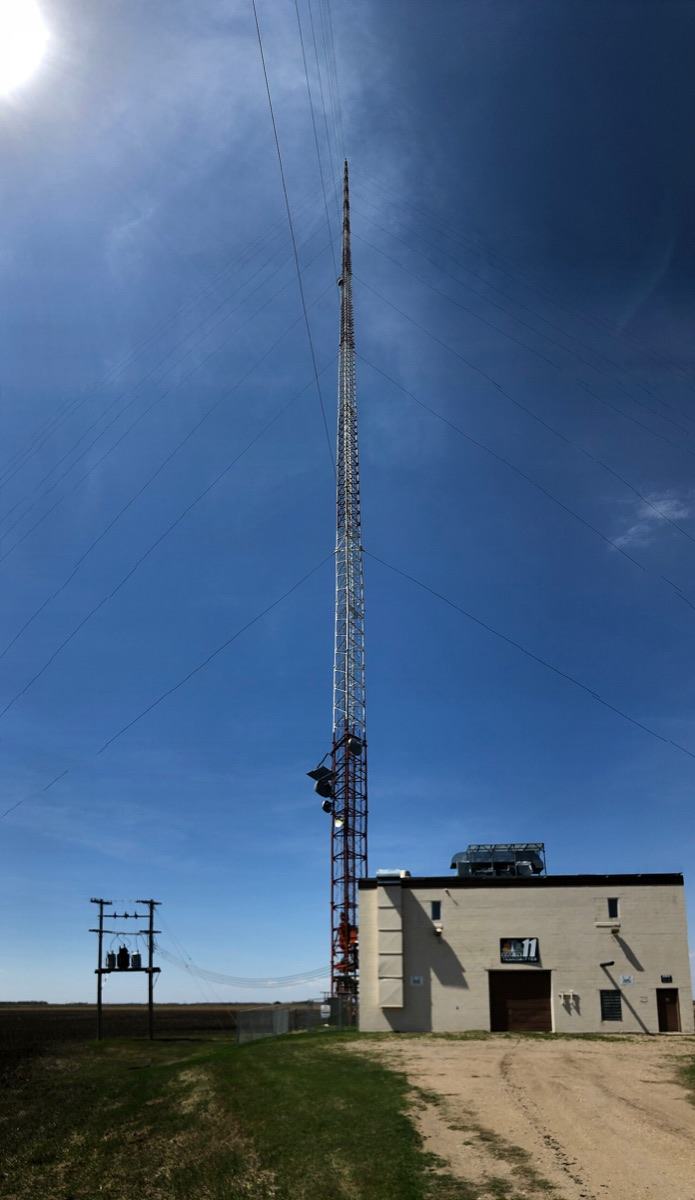 The KVLY-TV guyed mast in North Dakota rising above its transmitter building